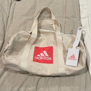 Adidas duffle bag and luggage tag. New without tags.